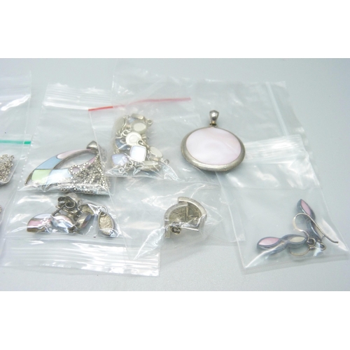 934 - Silver jewellery including pendants and chains, three pairs of earrings, bangle, etc.