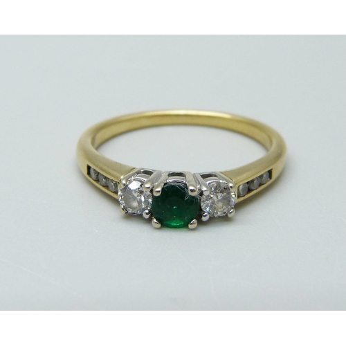 947 - An 18ct gold, emerald and diamond ring, 3.1g, N