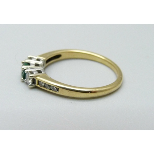 947 - An 18ct gold, emerald and diamond ring, 3.1g, N