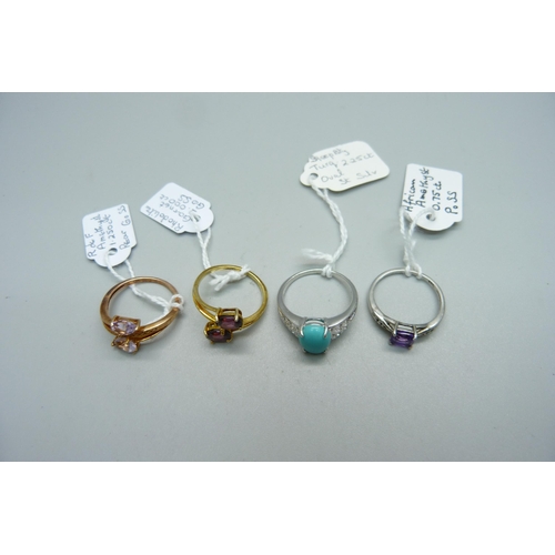 951 - Four sterling silver rings set with amethyst, rhodolite, garnet and turquoise, 3x O and Q