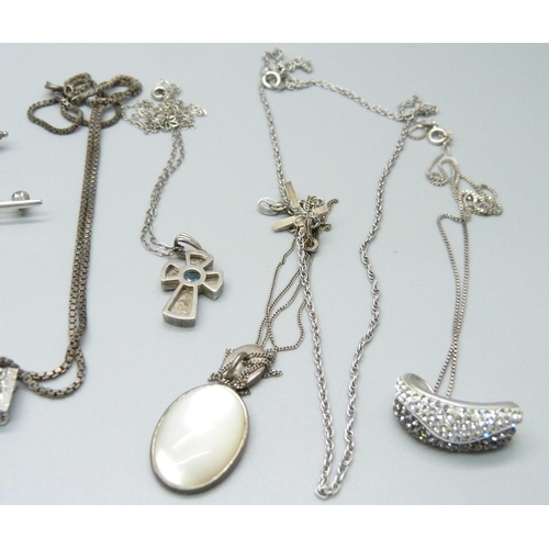 953 - Five silver pendants and chains, a silver necklet, two other pendant and chains, one silver ring, et... 