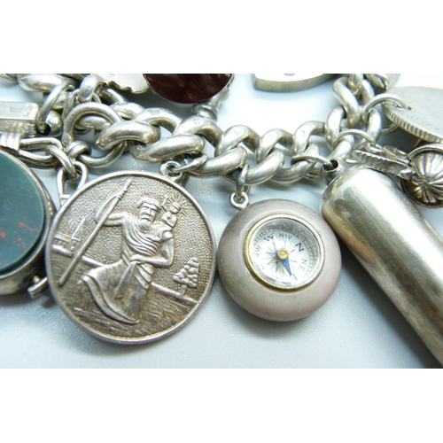 960 - A silver charm bracelet, with Victorian silver swivel fob, a hallmarked Victorian silver violin char... 