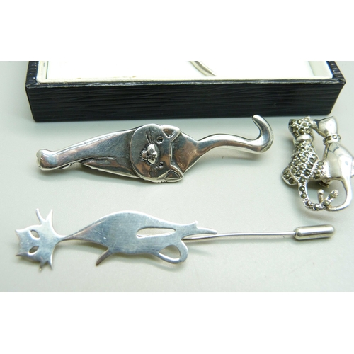 963 - Two silver cat brooches, a cat pin and a silver necklace