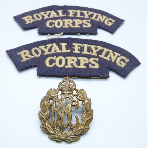 977 - Two Royal Flying Corps shoulder badges and a metal badge