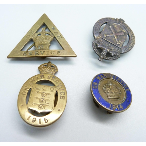 978 - Four WWI 'On War Service' lapel badges, the triangular badge by Gaunt and numbered 475481