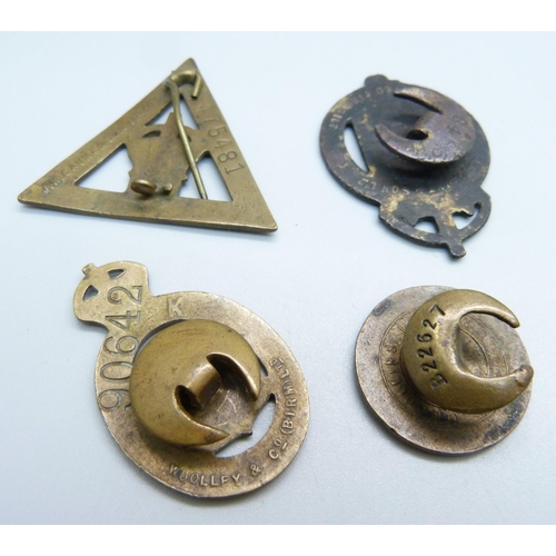 978 - Four WWI 'On War Service' lapel badges, the triangular badge by Gaunt and numbered 475481