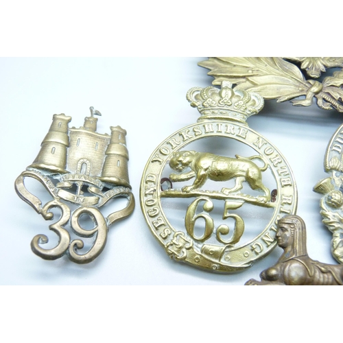 990 - Victorian British Army helmet plates and cap badges