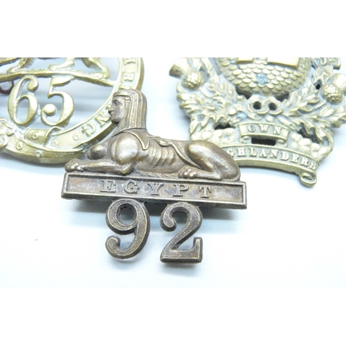 990 - Victorian British Army helmet plates and cap badges