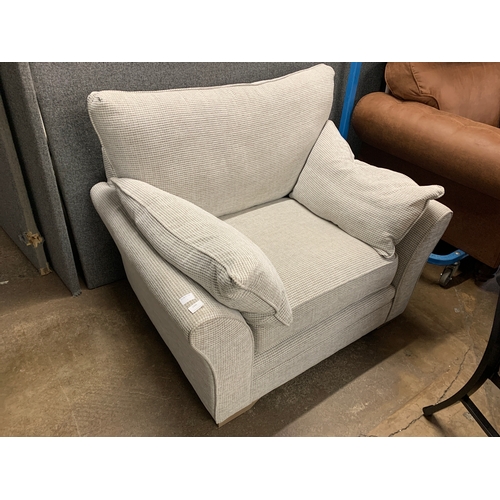 1430 - A light grey textured weave oversized armchair