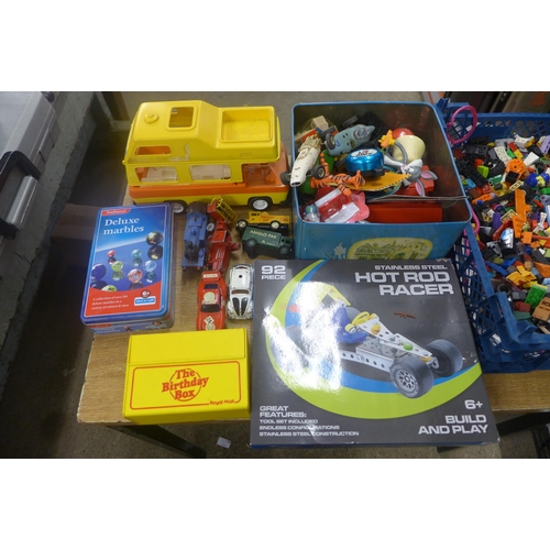 2083 - A box of toys inc. deluxe marbles, hot rod racer Lego, and toy cars