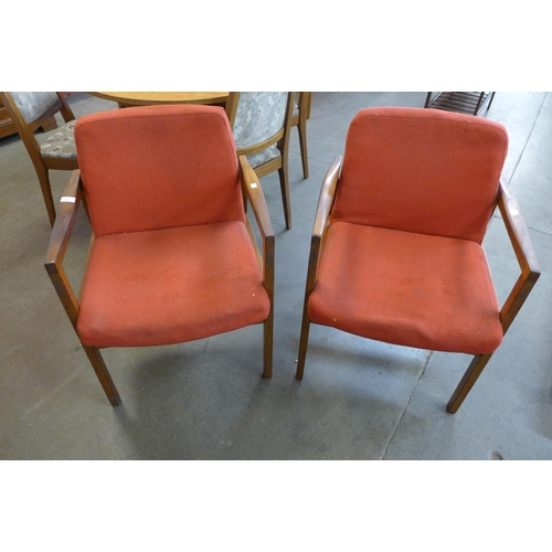 13A - A pair of teak elbow chairs