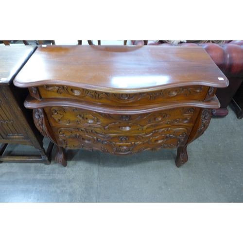 151 - A Dutch style hardwood bombe shaped commode