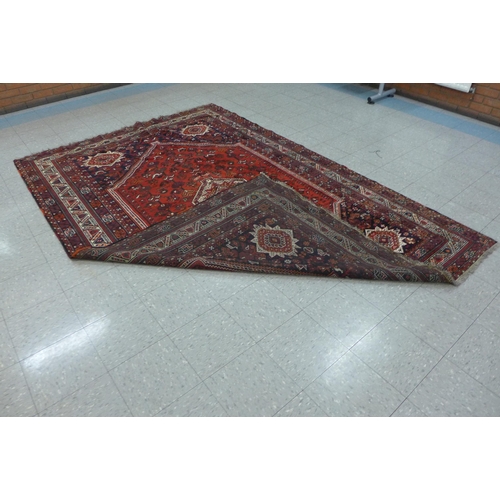 159A - An eastern red ground rug, 308 X 209cms