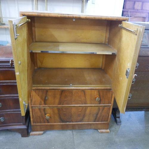 203 - An Art Deco walnut tallboy and a carved oak bureau