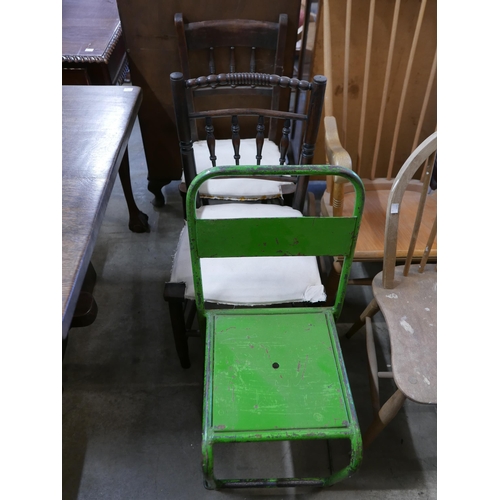 208 - A beech rocking chair, a mid 20th Century painted metal chair, an Ercol kitchen chair, two cane armc... 