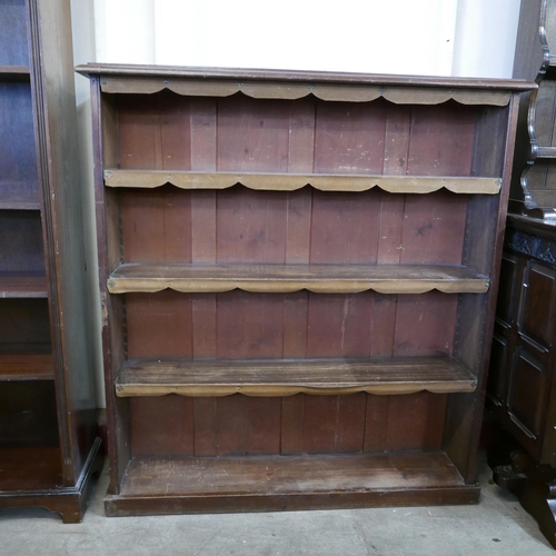 212 - A tall mahogany open bookcase and one other