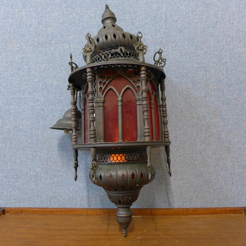 252 - A Turkish metal and red glass hanging ceiling lantern