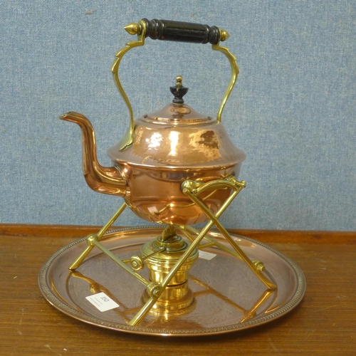 350 - An Arts and Crafts copper and brass spirit kettle, manner of W.A.S. Benson and a small copper tray