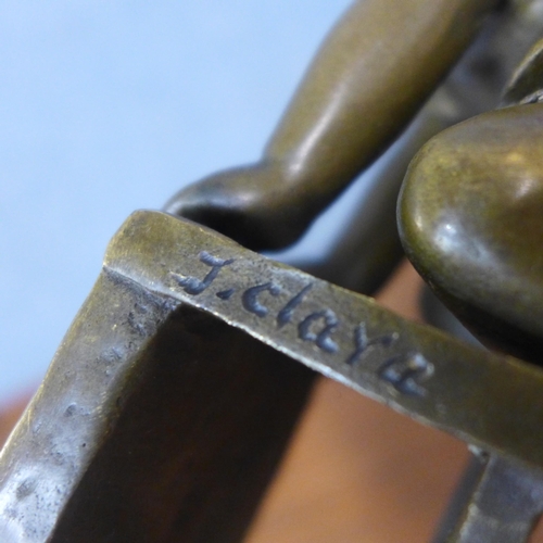 359 - A pair of bronze figures of children playing on stools, manner of J. Clara