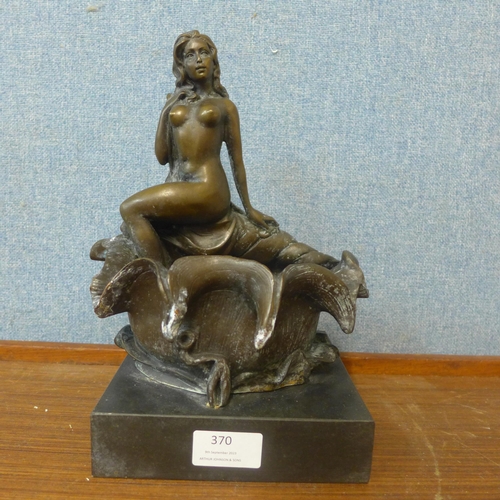 370 - An Art Deco style bronze figure of a female nude sat on a conch shell, on black marble socle