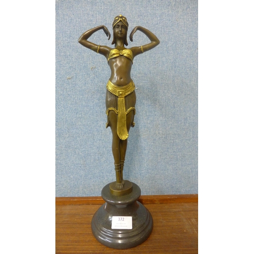 372 - An Art Deco style bronze and gilt painted figure of an exotic female dancer, on black marble socle