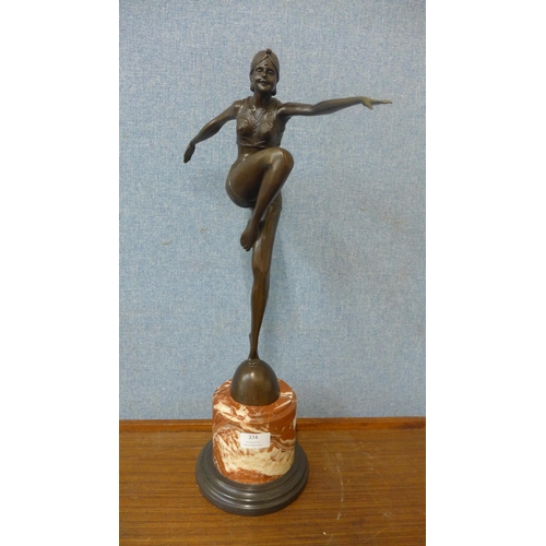 374 - An Art Deco style bronze figure of a female dancer, on rouge marble socle