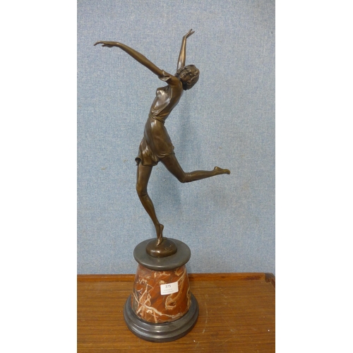 375 - An Art Deco style bronze figure of a female dancer , on rouge marble socle