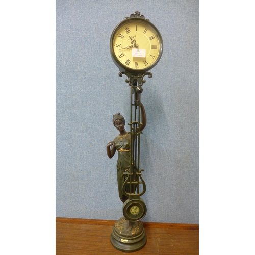 377 - An Art Nouveau style Juliana faux bronze figural mystery clock