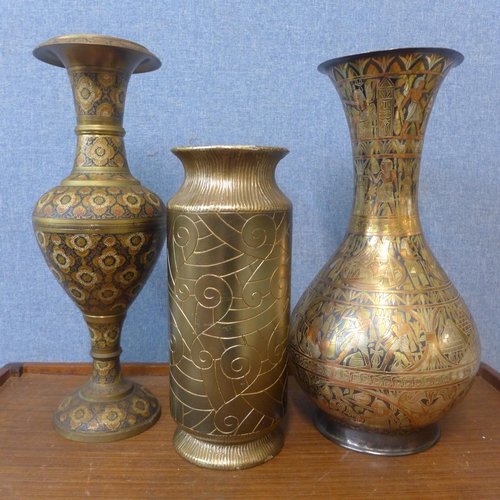 384 - An Egyptian brass vase, a Persian brass vase and one other