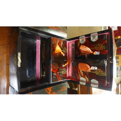 388 - A Victorian rosewood tea caddy and two oriental lacquered jewellery boxes