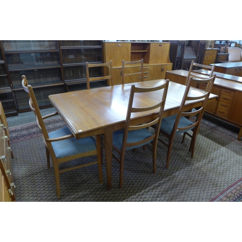 39 - A Danish teak extending dining table and six chairs