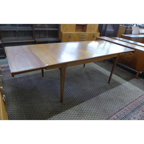 39 - A Danish teak extending dining table and six chairs