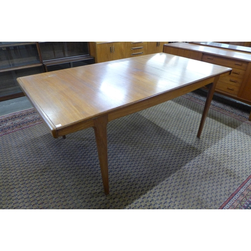 39 - A Danish teak extending dining table and six chairs