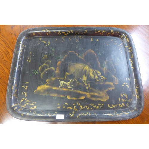 391 - A large Victorian black metal tray, decorated with dog and boar