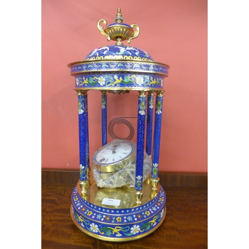 394 - A French style gilt metal and blue champleve enamelled temple desk clock