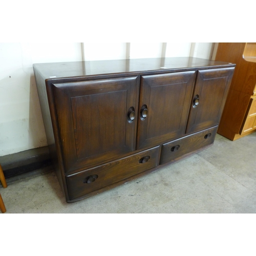 44 - An Ercol Golden Dawn elm Windsor sideboard