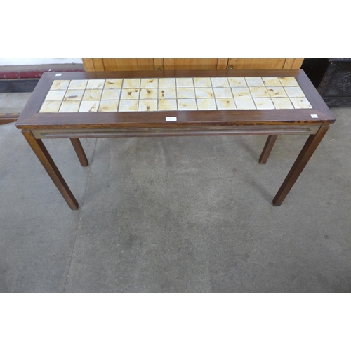 64 - A Danish teak and tiled top hall table