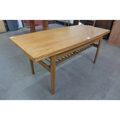 7 - A Danish teak metamorphic dining/coffee table