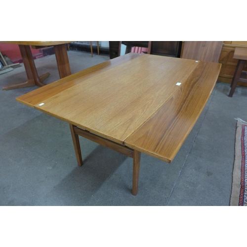 7 - A Danish teak metamorphic dining/coffee table