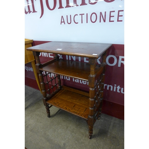 70 - An Arts and Crafts Liberty & Co. oak reading stand, designed by Leonard Wyburd