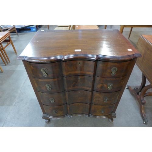 75 - A Queen Anne style mahogany and figured walnut chest of drawers