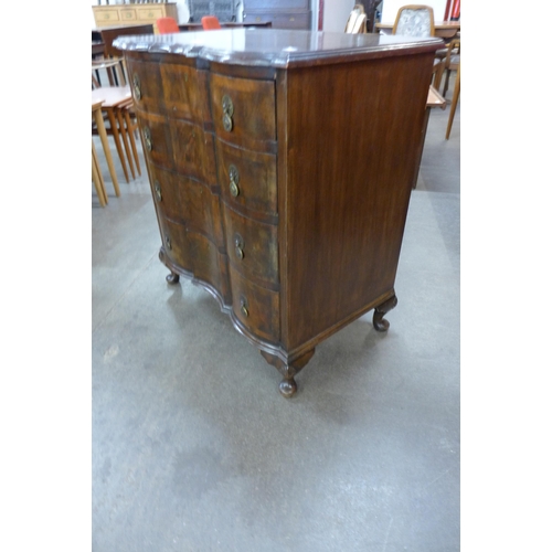 75 - A Queen Anne style mahogany and figured walnut chest of drawers