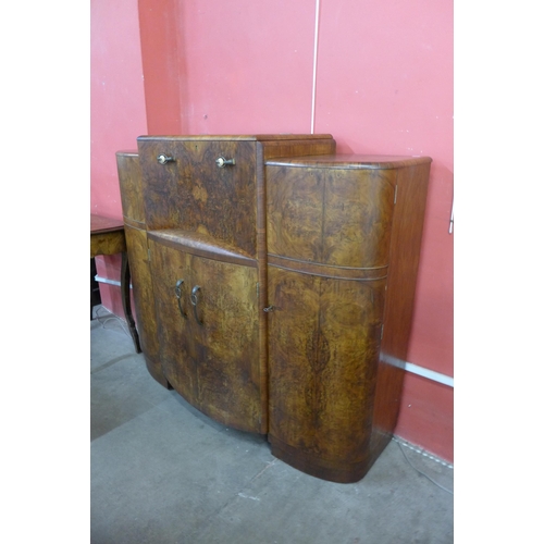 78 - An Art Deco burr walnut cocktail cabinet