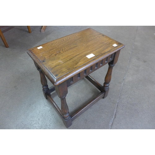 85 - A 17th Century style carved oak stool