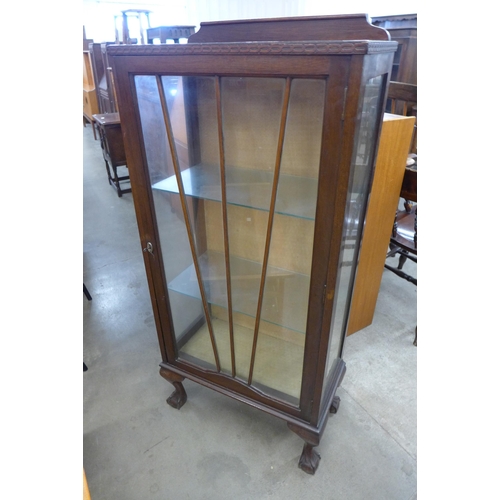 90 - A mahogany single door display cabinet