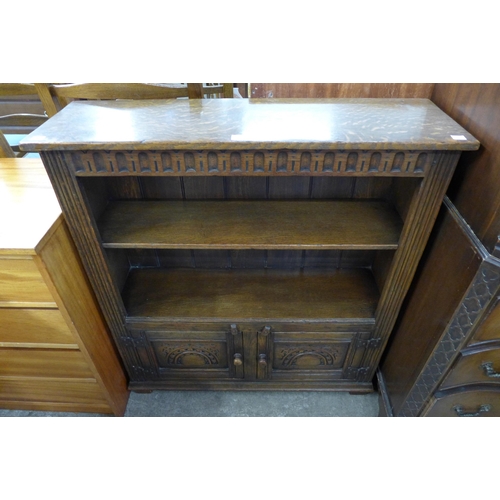 92 - A 17th Century style carved Ipswich oak open bookcase