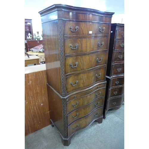 93 - A George III style mahogany serpentine chest on chest