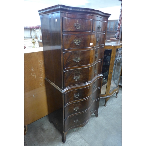 94 - A George III style mahogany serpentine chest on chest