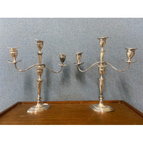 367A - A pair of three branch silver plated candelabra