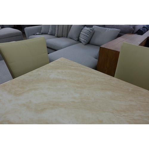 1446 - A cream marble effect dining table with a set of four cream leather dining chairs